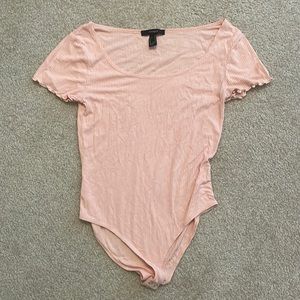 Light pink body suit